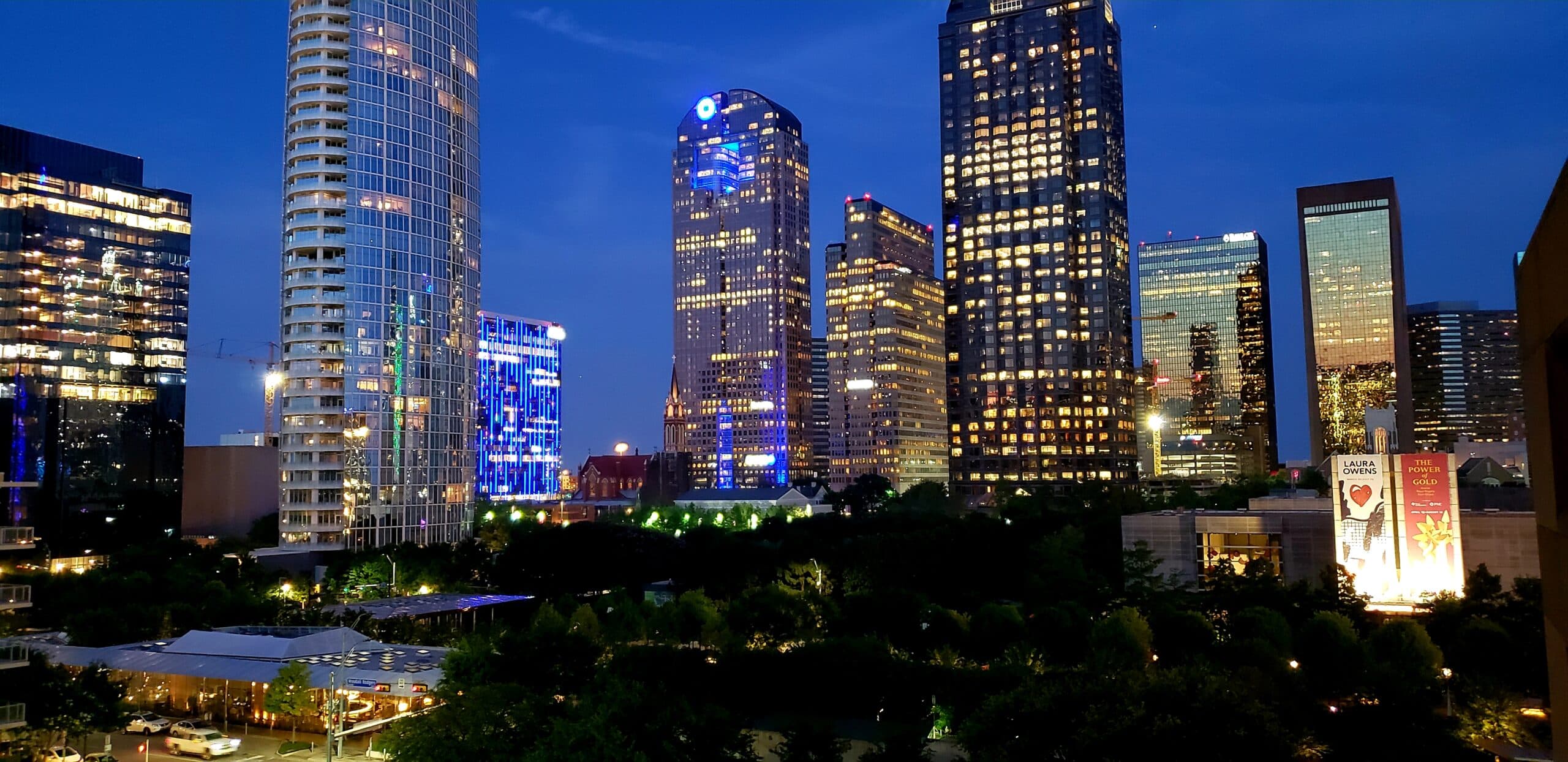 Downtown Dallas office towers at dusk seen from Klyde Warren Park